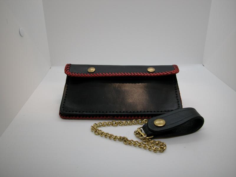 This Midnight Black Trucker Style Wallet Made With Red Leather Lacing comes With a Brass chain and leather Belt Loop Tether, Custom, Full Grain Leather, Hand tooled, Hand Made in the Okanagan, Oliver, B.C., Canada.